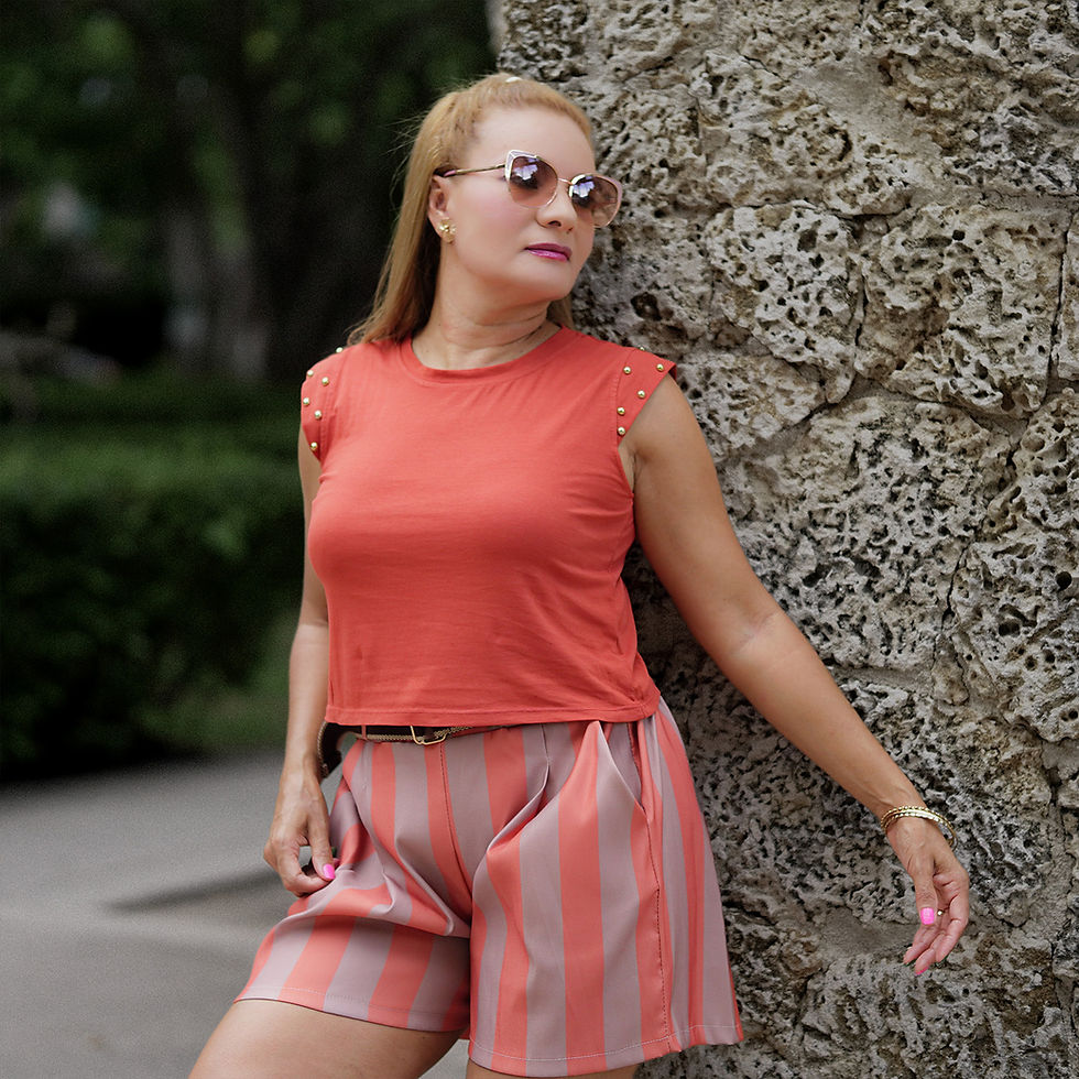Thumbnail: Timeless white striped shorts with orange accents and a brown fabric belt
