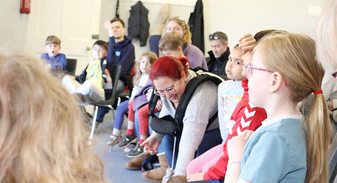 A group of participants enjoy a ZooLab show.