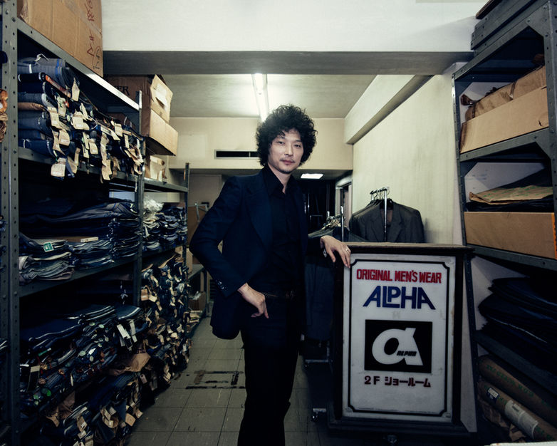 Designer Kyosuke Kunimoto in Tokyo Japan amongst fabric swatches for Billboard Magazine