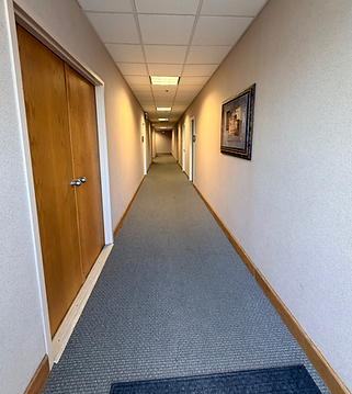 The hallway leading to Renewal Family Therapy's office in the One Ambassador building in Kansas City, MO