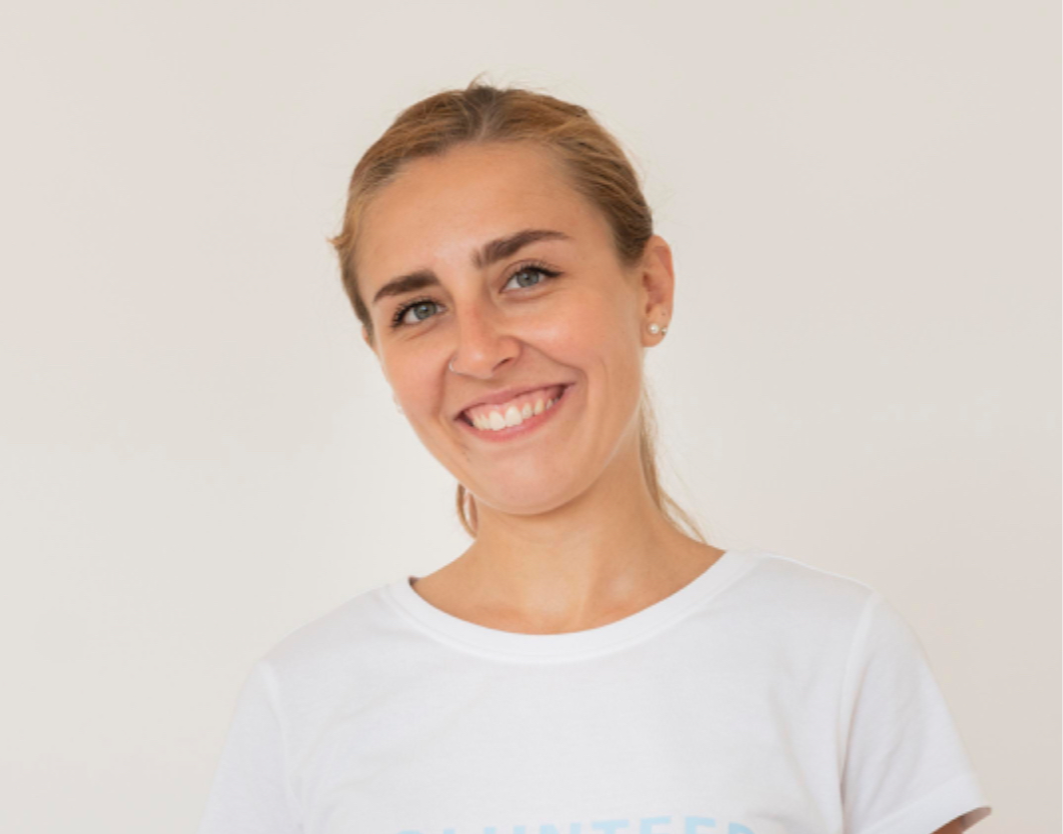 smiley-volunteer-with-gloves-handling-box-food-donations_edited_edited.png