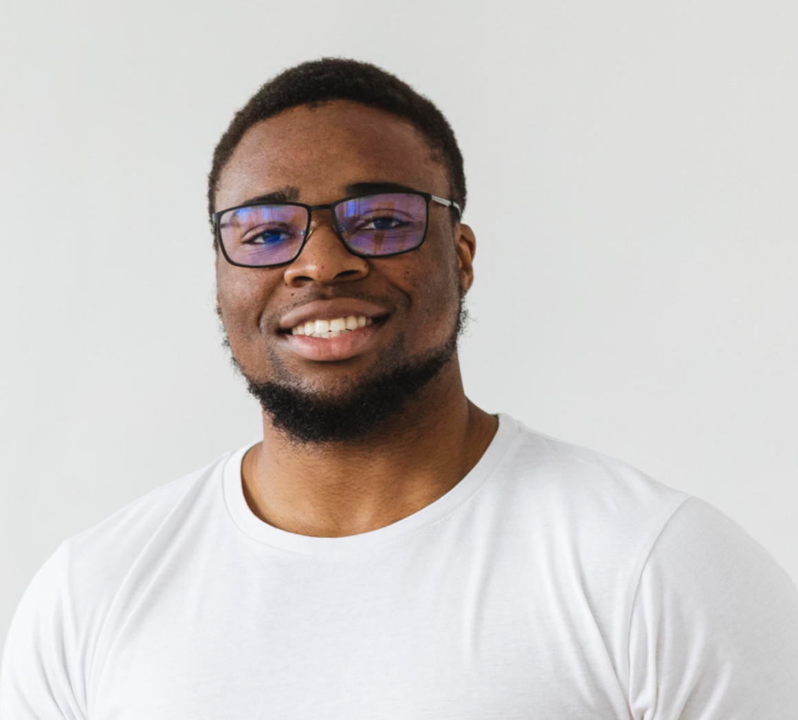 smiley-male-volunteer-holding-food-donations_edited.jpg