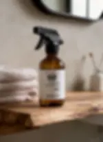 Natural room spray on rustic bathroom table