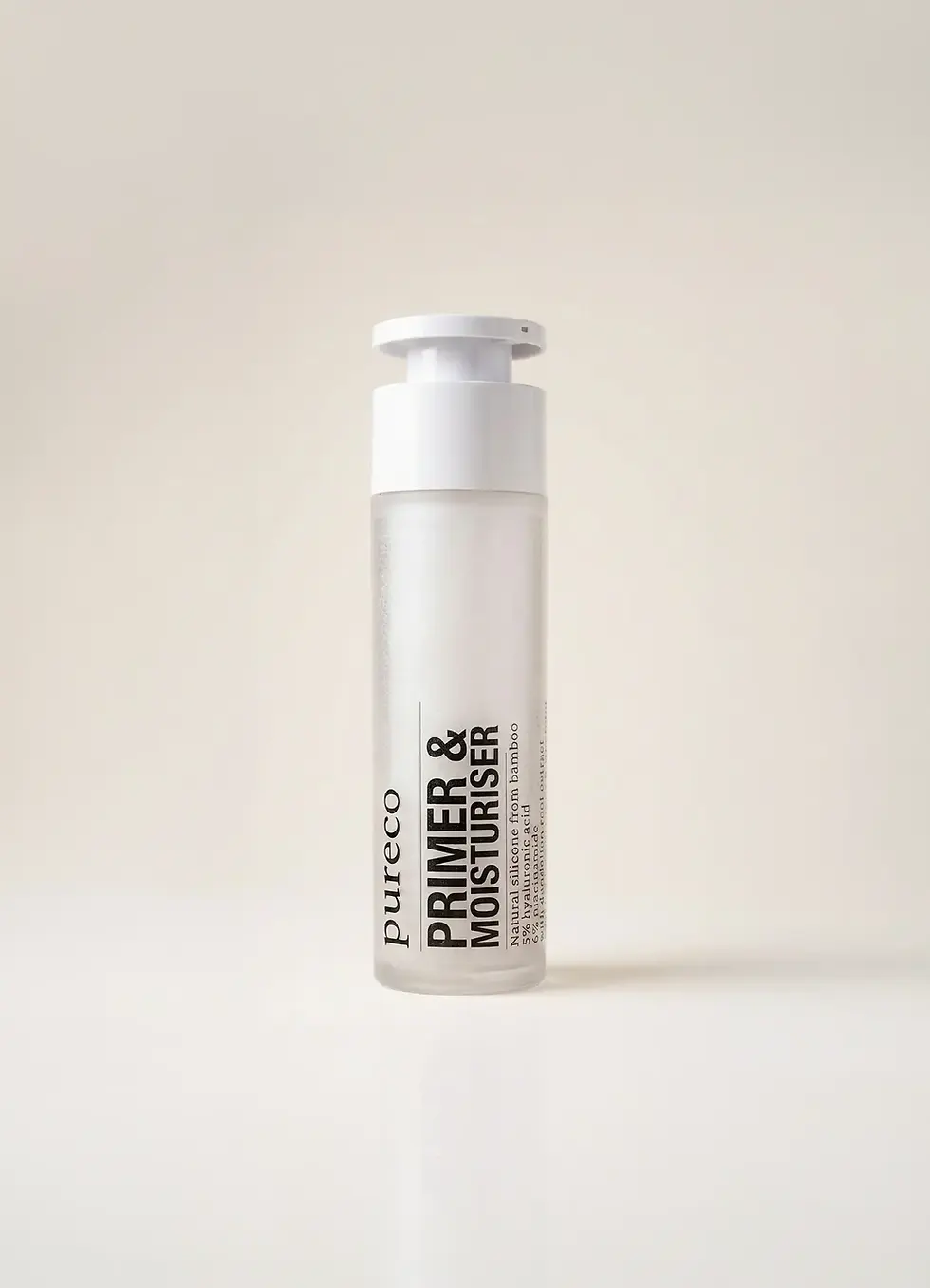 bamboo primer and moisturiser refillable bottle in studio shot with neutral cream background