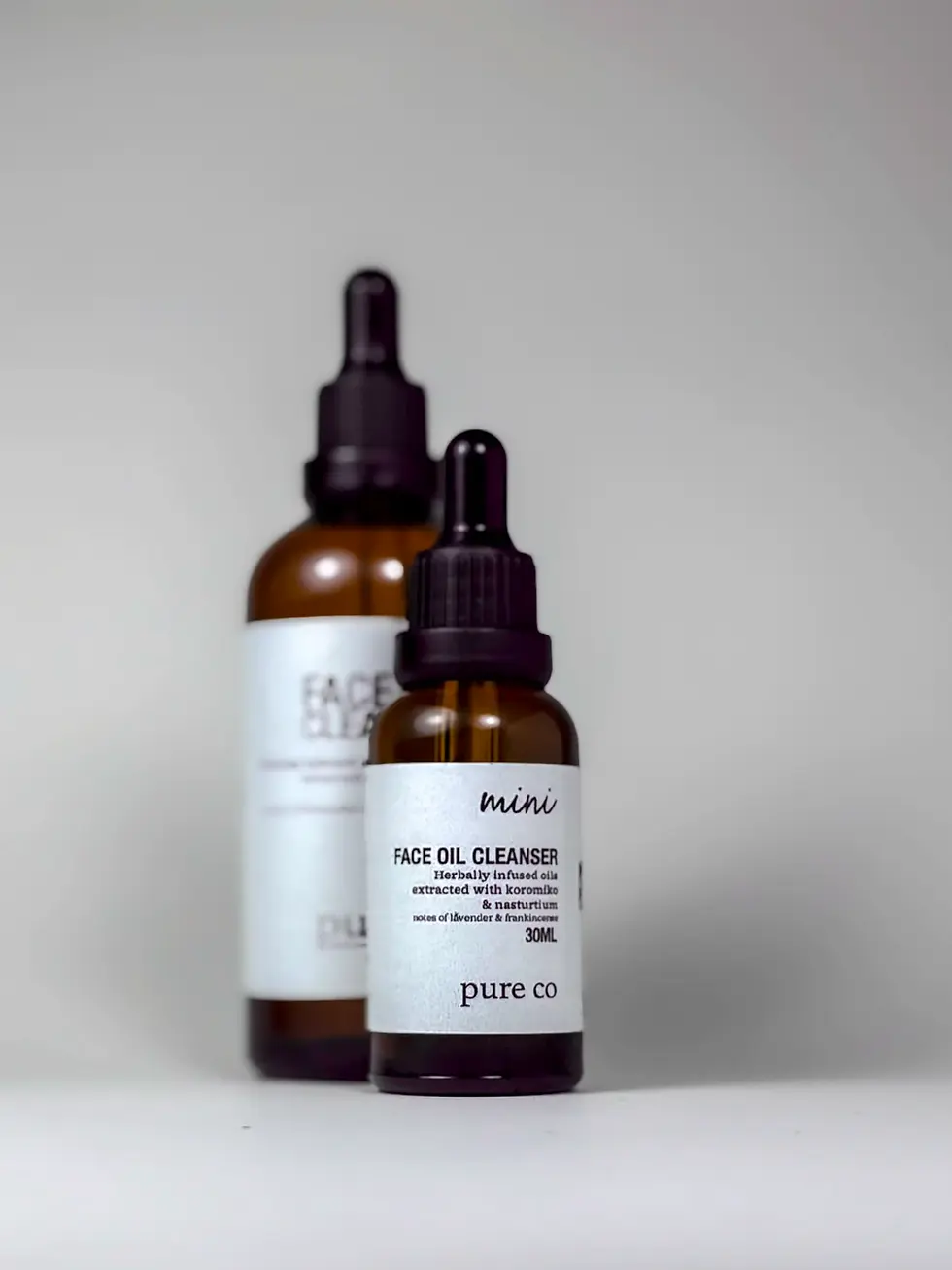 Thumbnail: Travel mini sample size of Face Oil Cleanser & Makeup Remover in Glass Amber Bottle with dropper