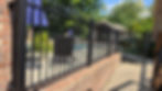 Black metal fence construction and remodeling for a patio.