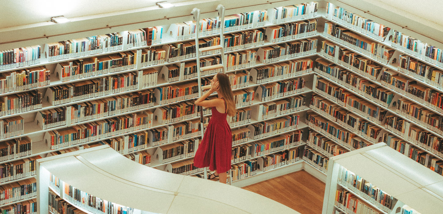 Girl in red photoshoot in public library
