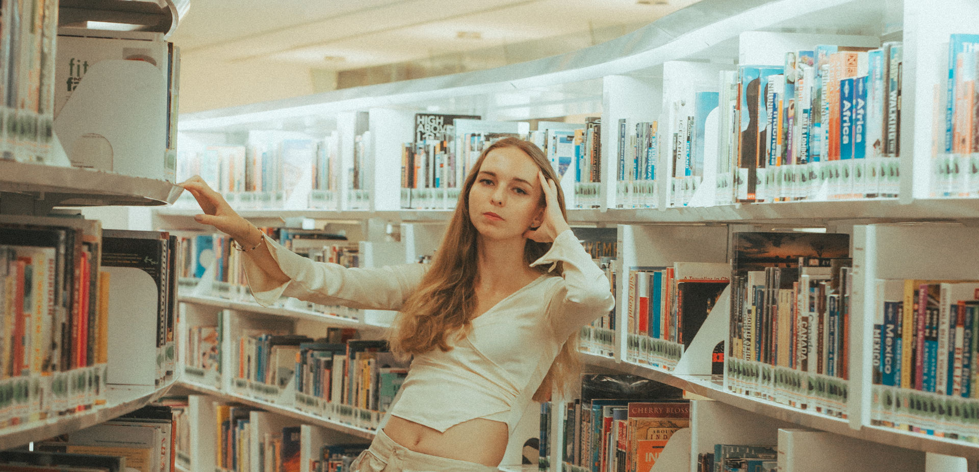 Girl in red photoshoot in public library