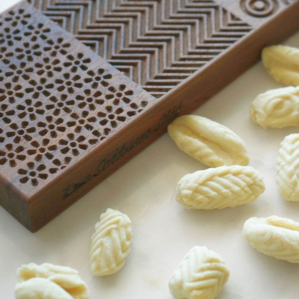 Thumbnail: Walnut gnocchi pasta rolling board with homemade gnocchi scattered around
