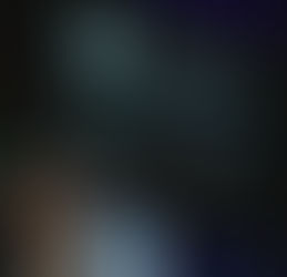 A person on stage behind a podium at iPRES 2024.