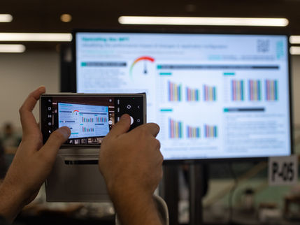A phone in front of a screen at iPRES 2022 in Glasgow.
