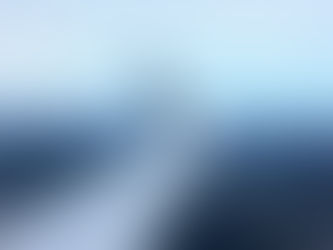 An Air NZ airplane wing in the skies over Wellington