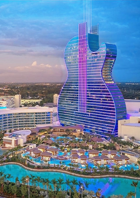 Aerial view of the iconic Seminole Hard Rock Guitar Hotel showcasing its unique architecture and luxurious design, a hallmark of South Florida construction projects