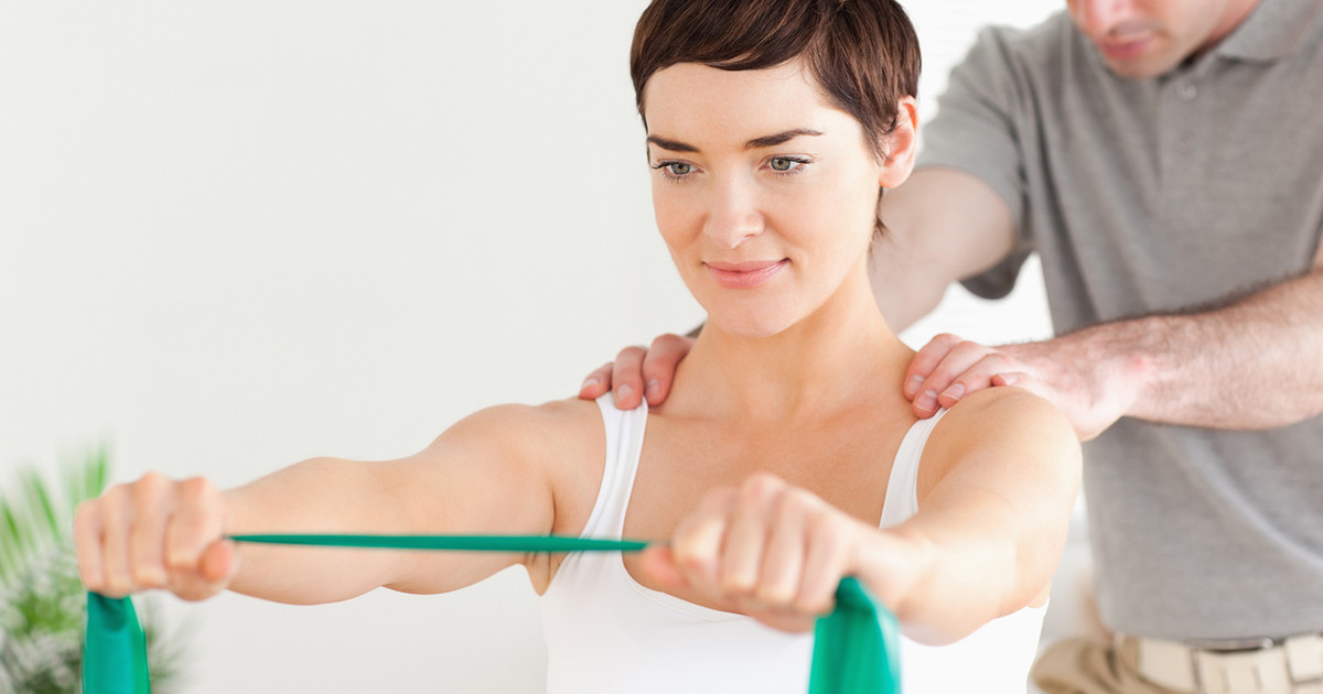 A person performing simple strengthening exercises at home using a resistance band, demonstrating how building strength supports everyday activities and independence.