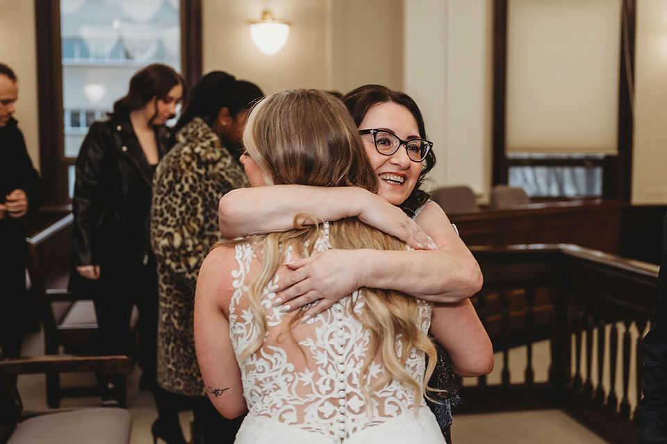 A photo of a couple getting married at the St. Catharine's courthouse