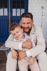 A photo of a groom with his son