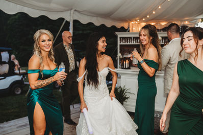 The bride dancing with her friends