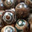 Thumbnail: 170100AGTE-10GRN • Tibetan Agate Dzi Eye Round Beads • 10mm | SmokyMountainBeads.com