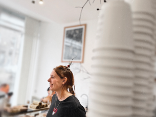 A RASA team member behind the café counter