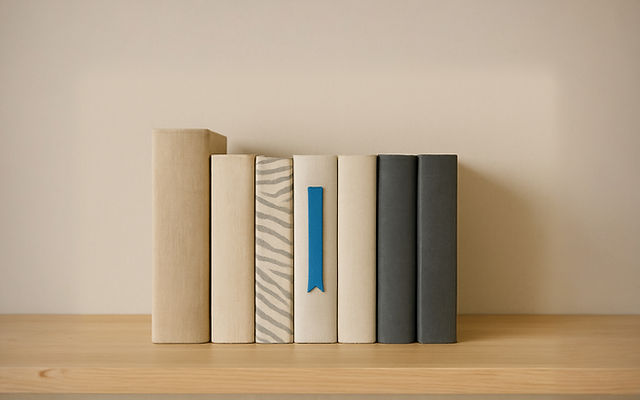 Books on a shelf, inviting clients to share their thoughts and feedback.