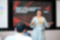 Melissa Chan presenting to on A Different Kind of Leadership Training to a room of global leaders