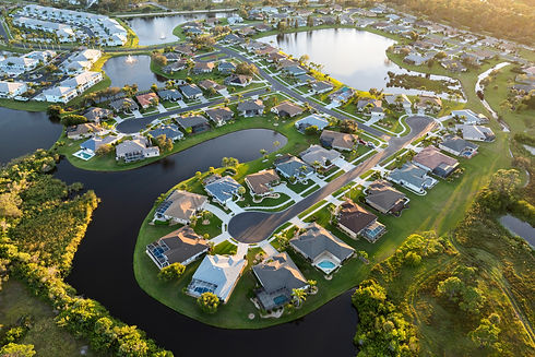 Top view of expensive private houses in Sarasota, Florida suburbia at sunset New family ho