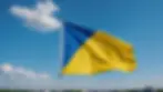 High angle view of the Ukraine flag waving amidst a clear blue sky