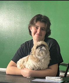 Pawtriotic Pet Hotel grooming team member with her dog in Murrieta