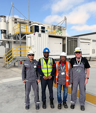 Project team in hard hats and hi-vis on site