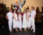 Rachel and Shane Krider with Prosperity Of Life leadership team at a white party during a Mediterranean cruise, celebrating success through imagination and vision.