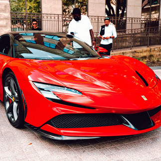 A Ferrari and a Lamborghini racing on a track, embodying the spirit of Italian supercars.