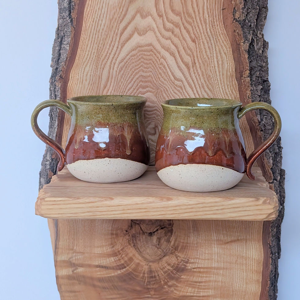 Two unique stoneware mug featuring a green and deep orange autumn glaze