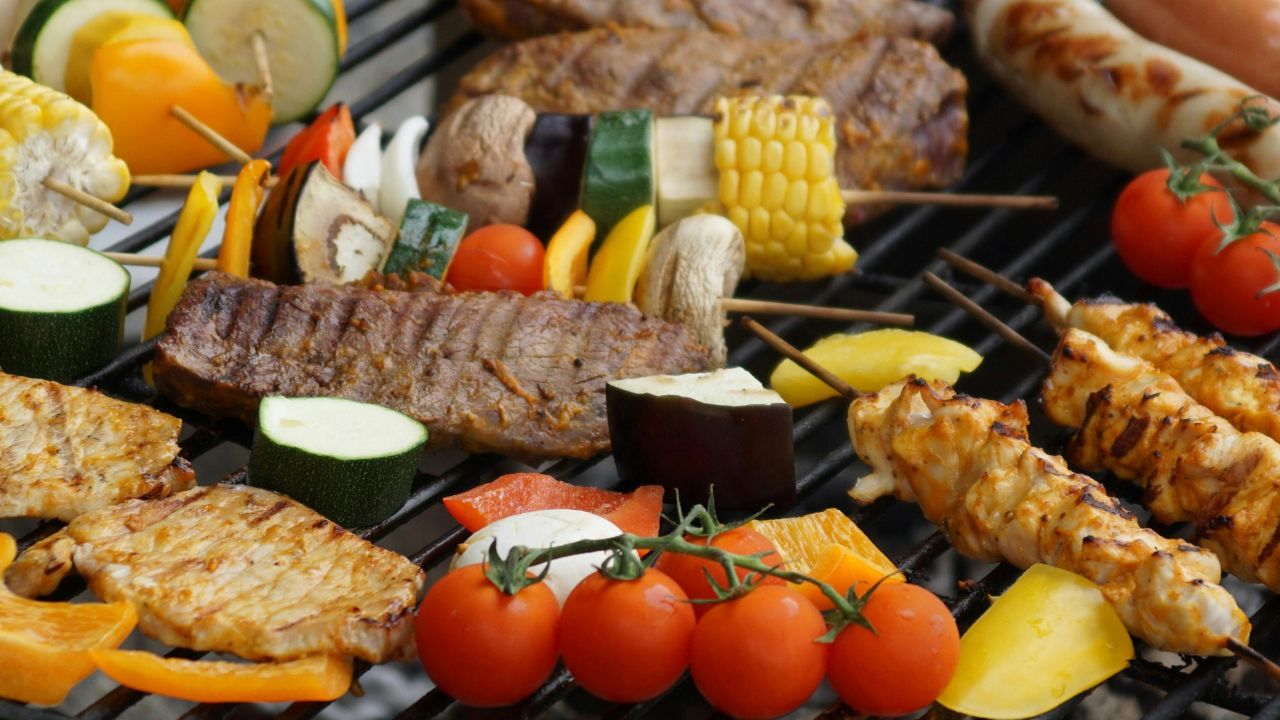 BBQ station with smoked brisket, pulled pork sliders and sides