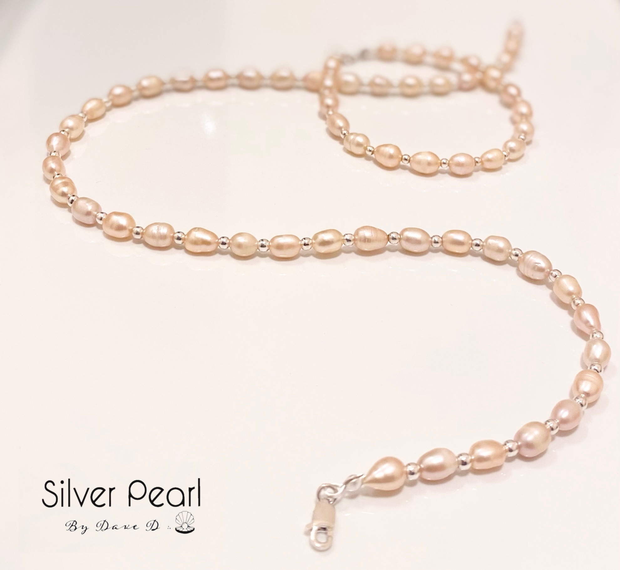 Juego de collar y pulsera de perlas rosas con plata cuencana