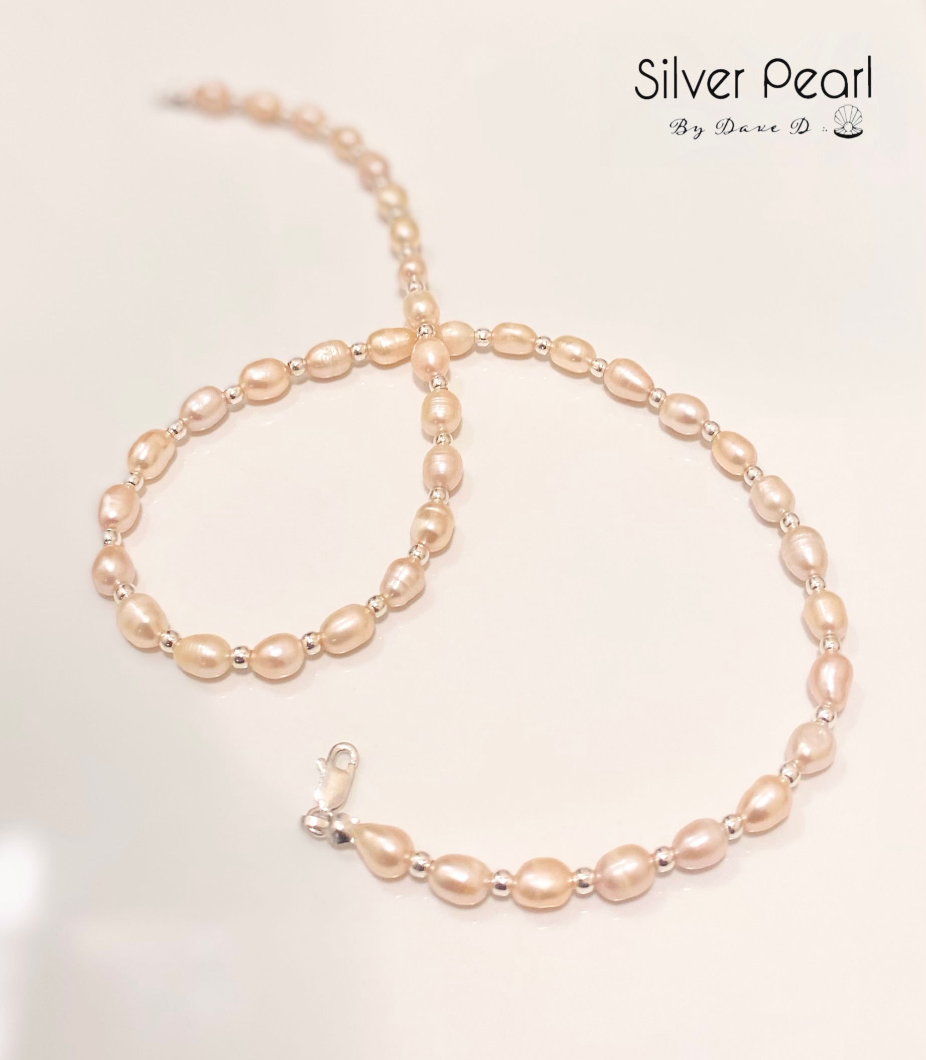 Collar de perlas rosas con plata cuencana