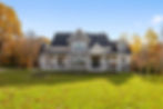 old-fort-house-with-trees-and-a-green-field-on-a-s-2025-02-09-22-14-42-utc.jpg