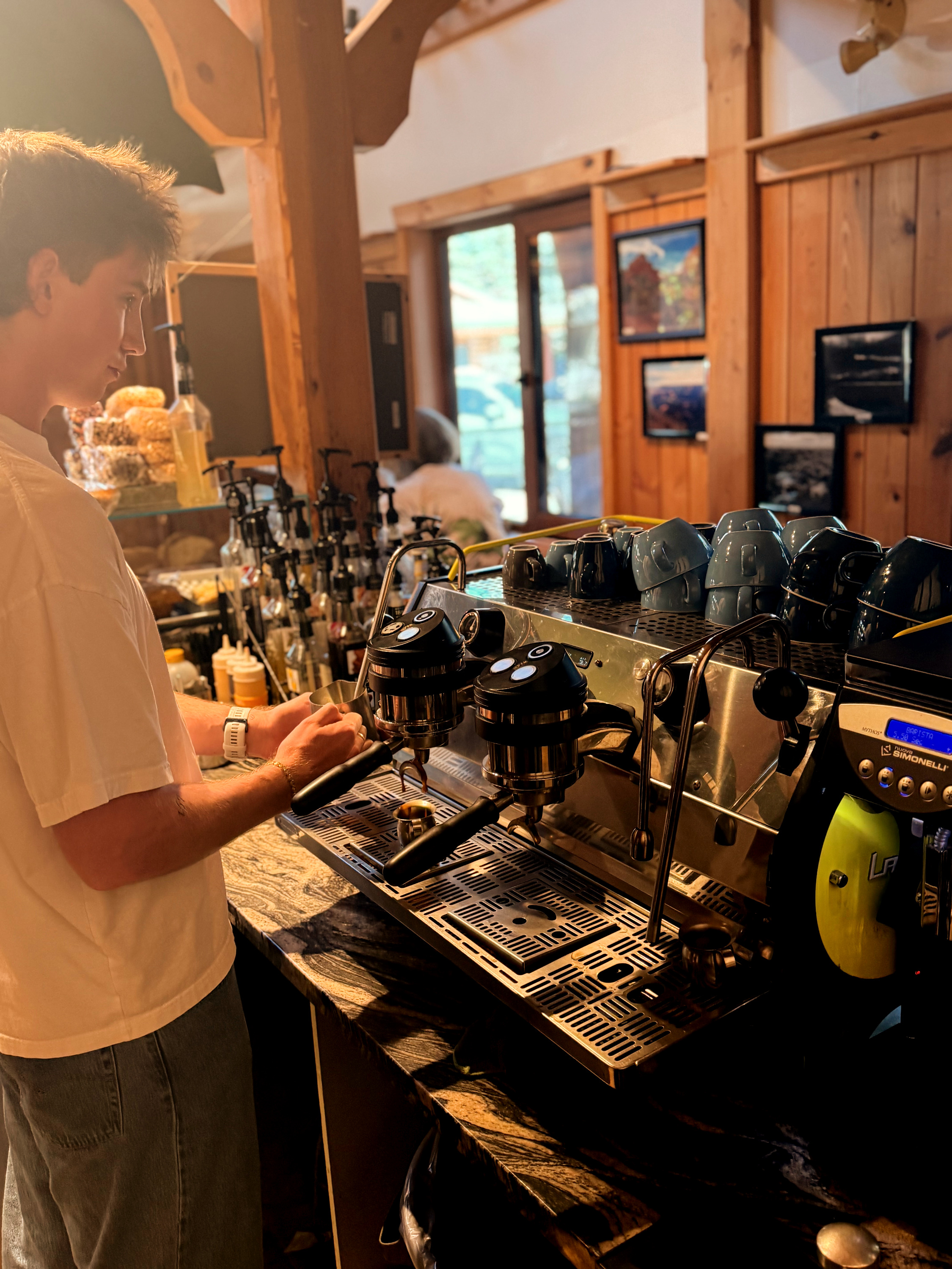 Barista preparing a "wild caffeinated concoction" at the espresso bar.