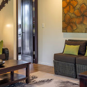 Villa living room with sofa, green cushions