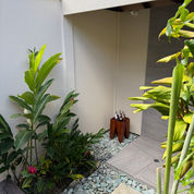 Outdoor villa bathroom with tropical garden surrounds