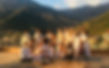 Yoga students and teachers after the completion of a YTTC course, wearing all white clothes and posing in a mountain area with smiley and happy faces breathe yoga yoga loft yoga shala corepower yoga near me