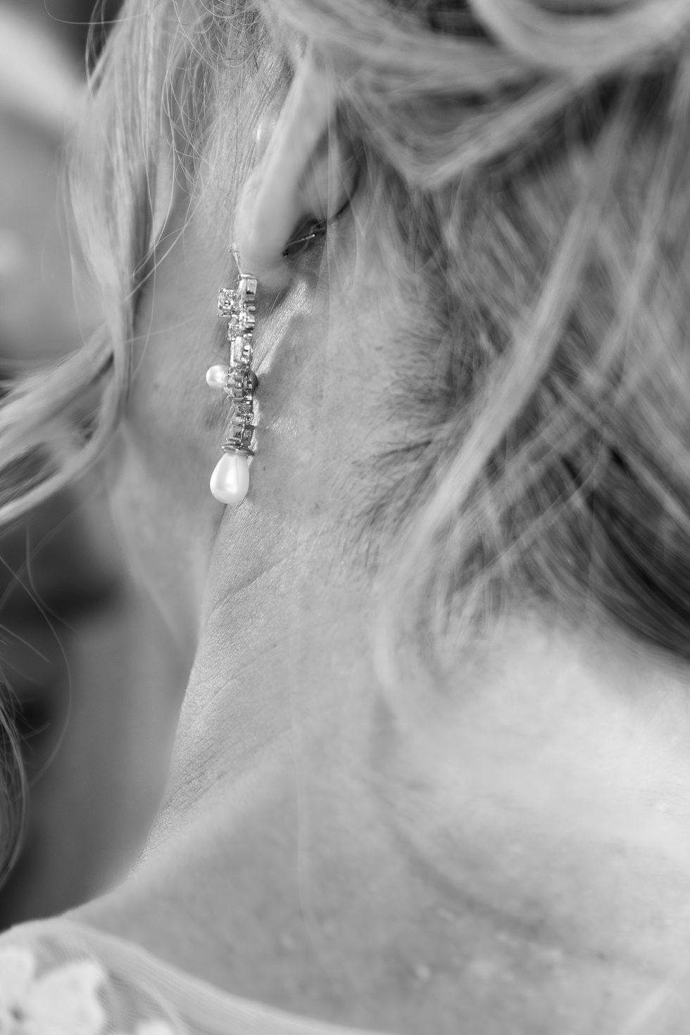 Close-up of an ear with an elegant earring.