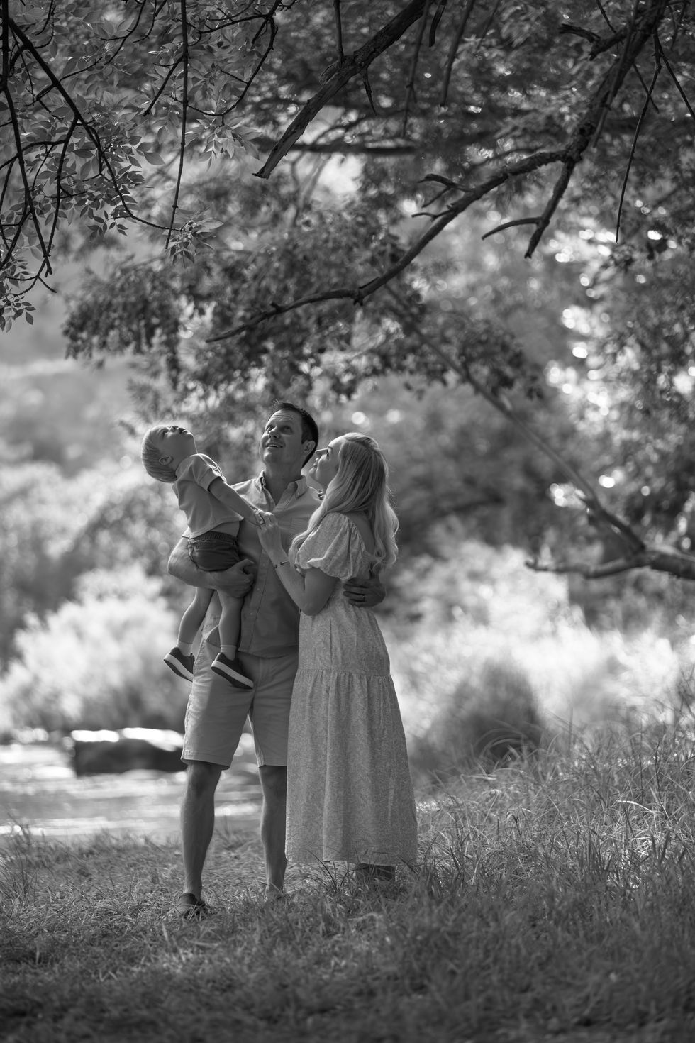 Family enjoying nature in a black and white photo.