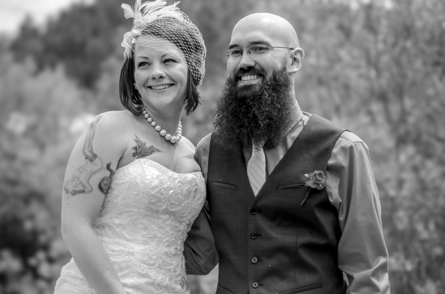 a black and white photo of a bride and groom