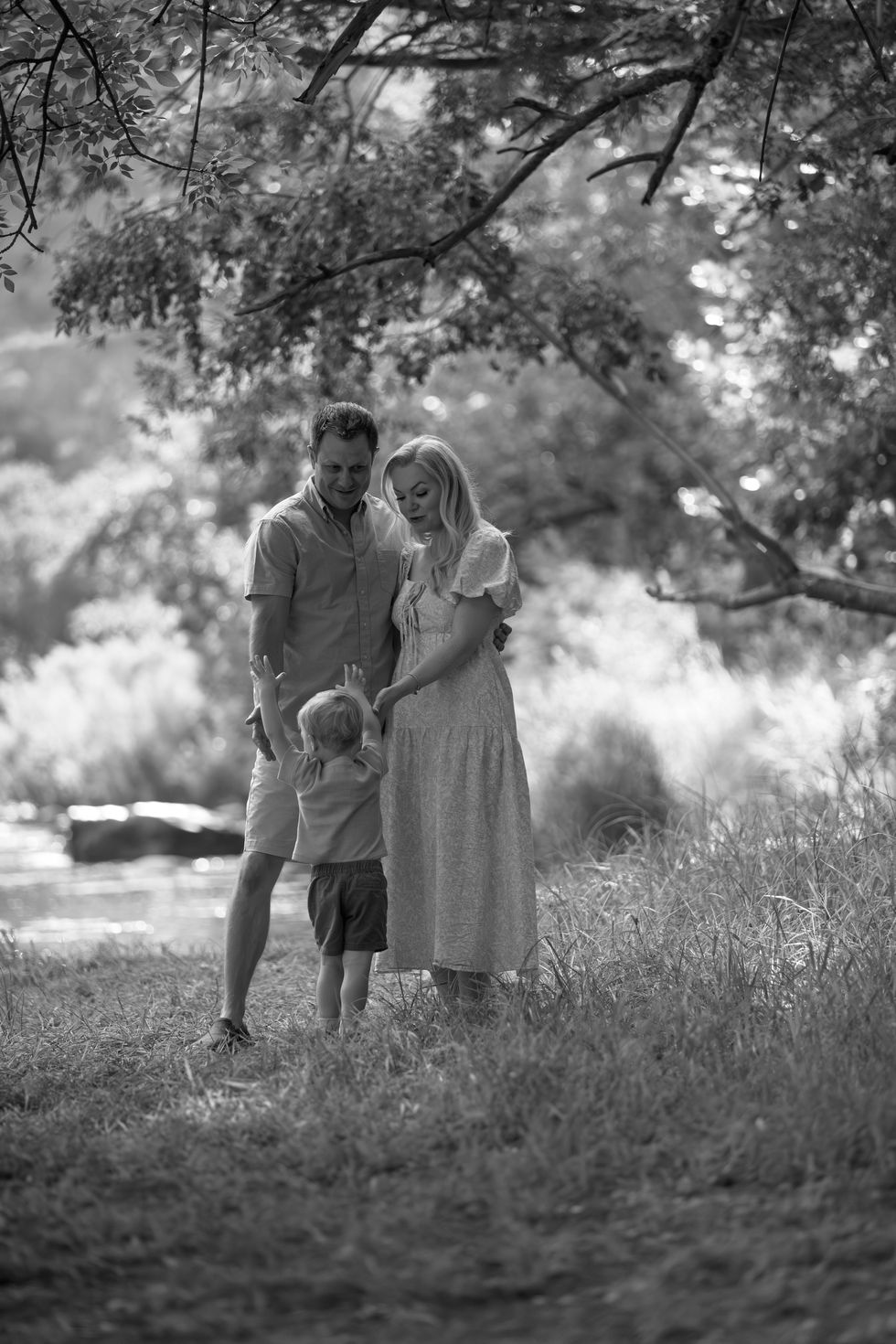 Family enjoying nature in a serene outdoor setting.