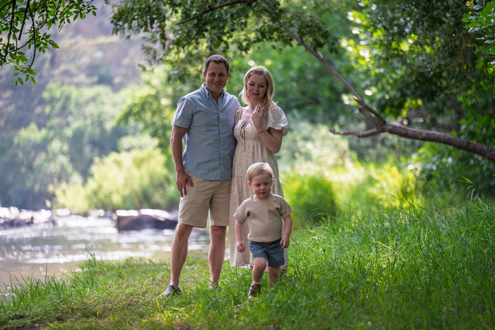 Family enjoying nature in a lush, green setting.