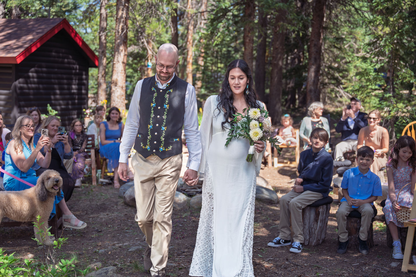 Bride and groom walking outdoors at a wedding.