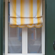 yellow and white roman shade