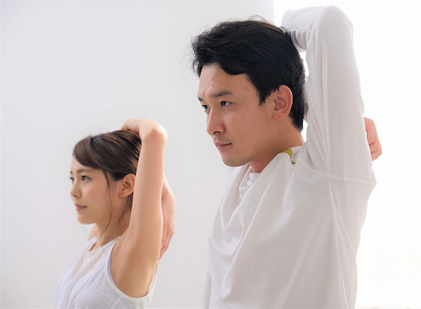 2 Patients Stretching Frozen Shoulders