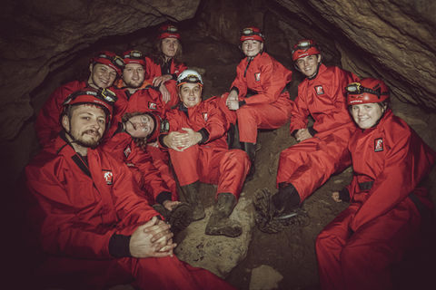 Caving instructor trainees underground during outdoor instructor training UK