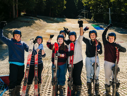 A bunch of skiers enjoying a taster lesson at Mendip